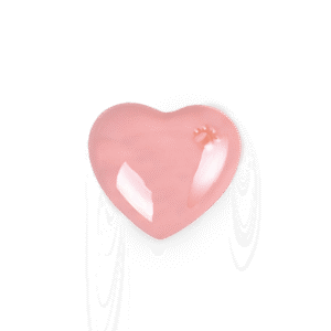 Keramikurne Herz in zartem Rosaton mit glänzender Glasur – sanft reflektierende Oberfläche.